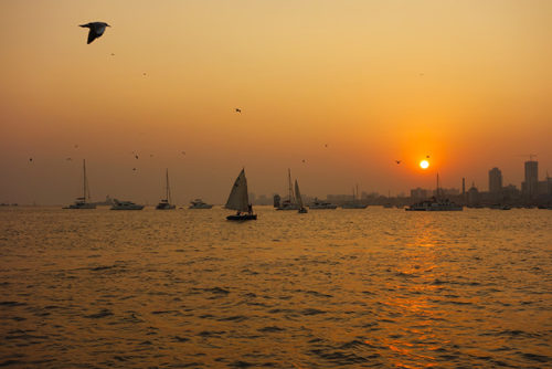 Boats, seagulls and sunset in Mumbai