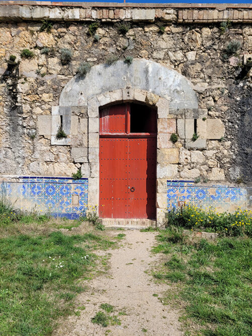 Red door and blue tiles